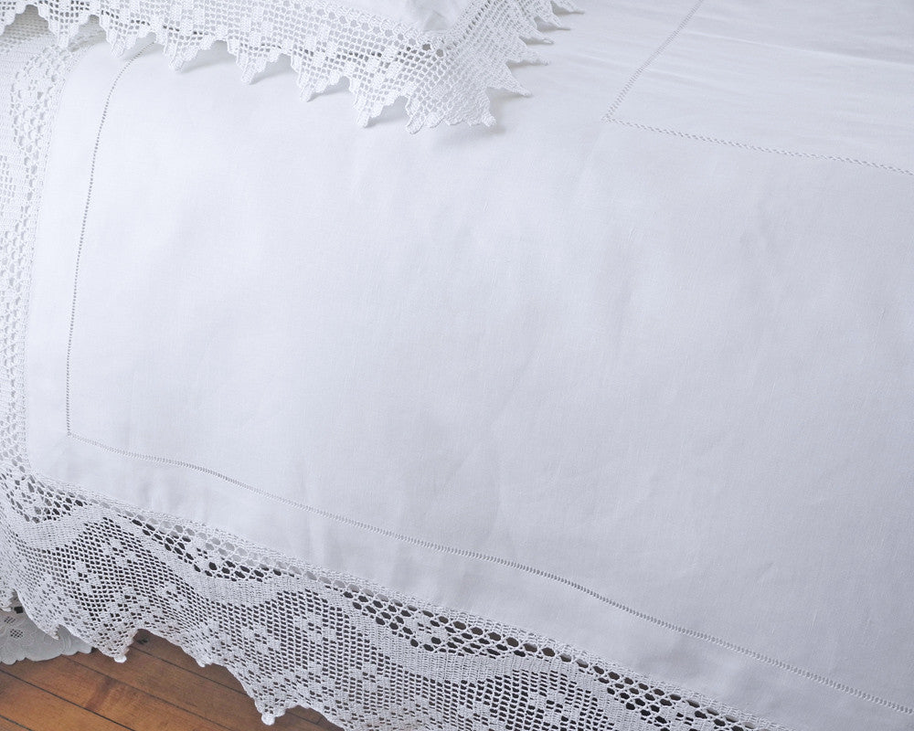 White Linen bedcover in French Country style decorated with hand drawn hemstitch and hand crochet border.