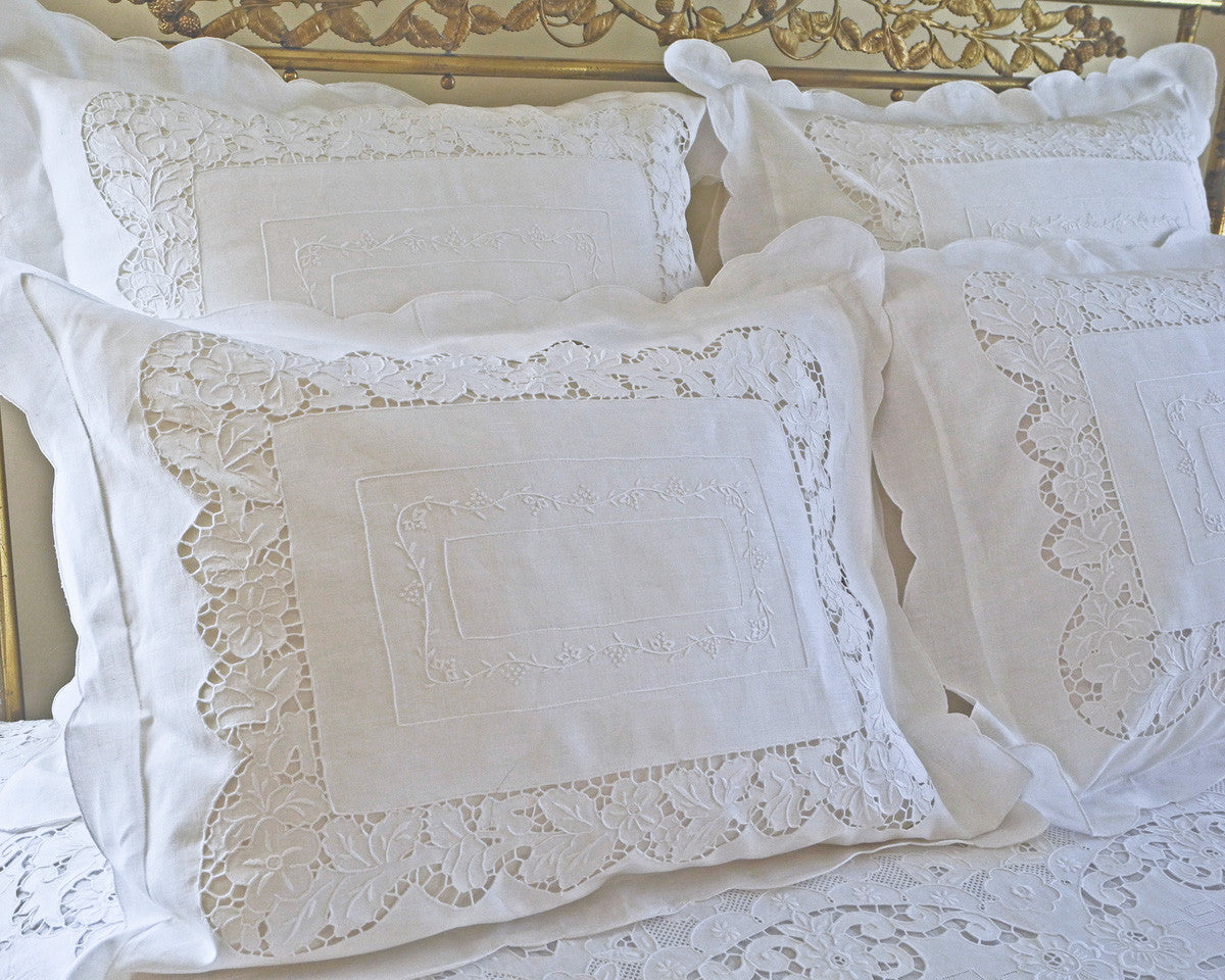 Standard sham, hand embroidered antique reproduction with grape leaf pattern.