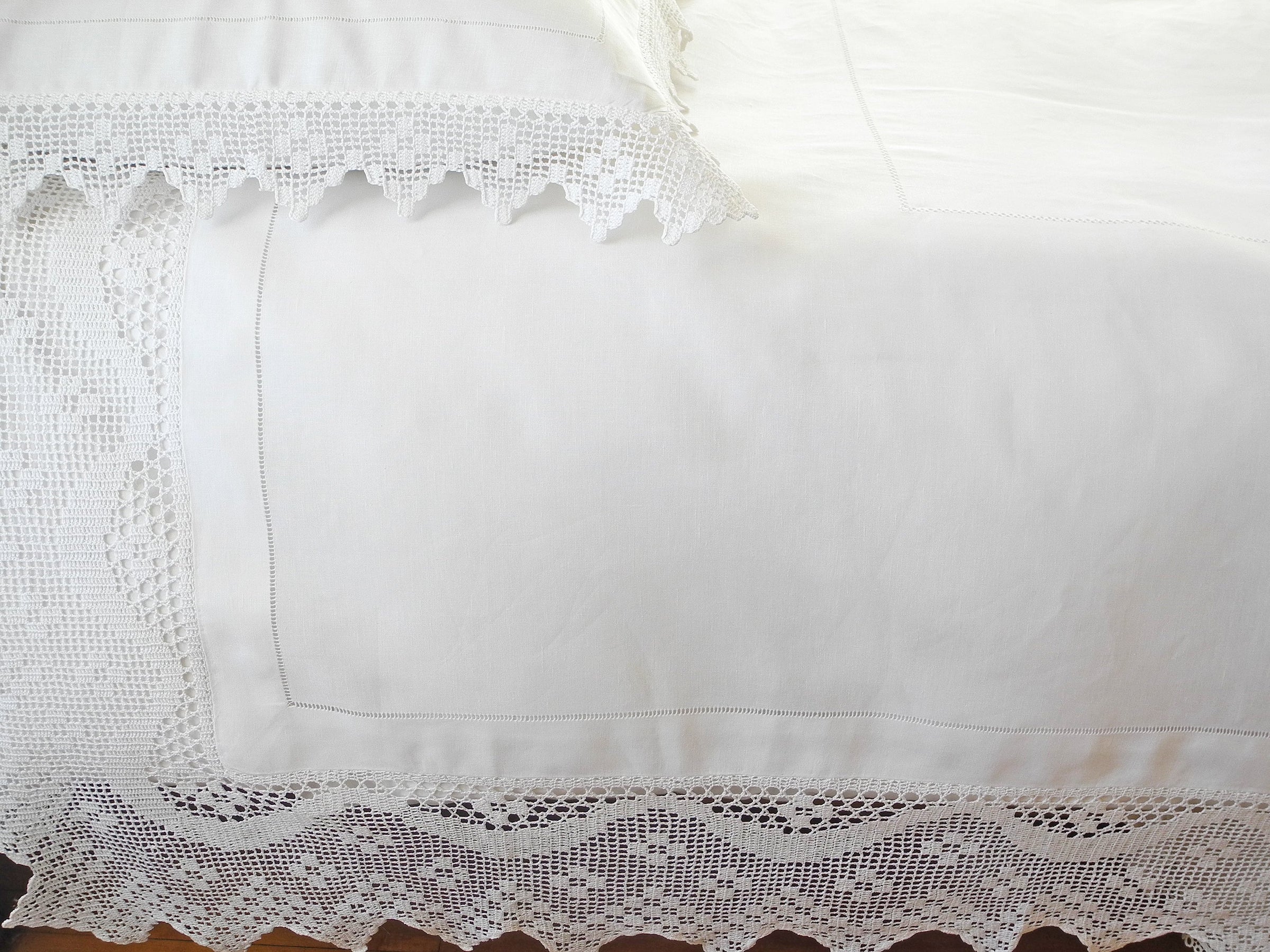 Handcrafted Antique Linens Collection, featuring meticulously crafted bed and table linens made from fine 100% linen. French Country-inspired design adds charm and elegance to any home decor.