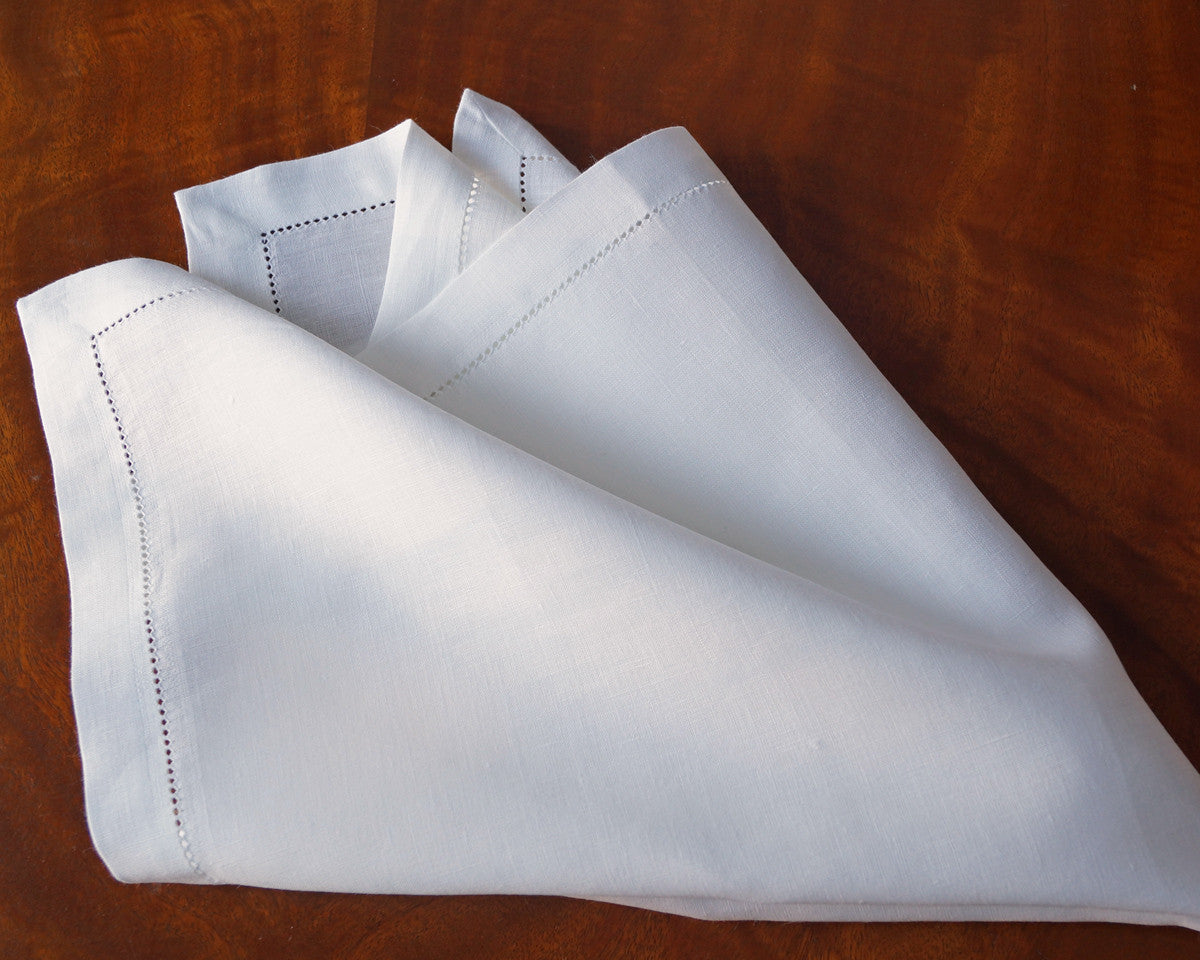 Large Dinner Napkin made of fine quality of linen and finished with one inch border and hemstitch.