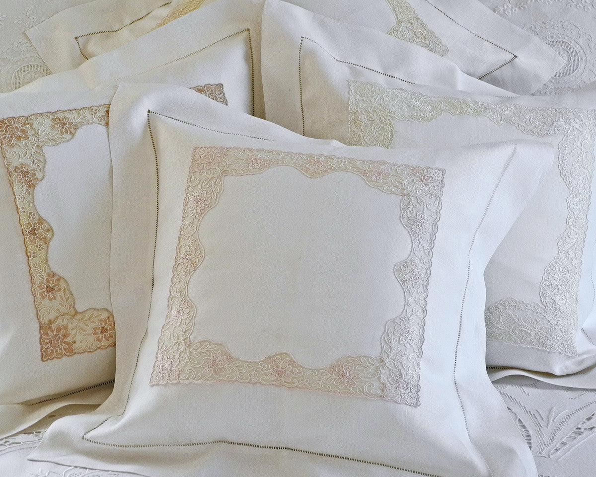Square pillow sham in white linen with 2" flange, hand drawn hemstitch and lace inset.