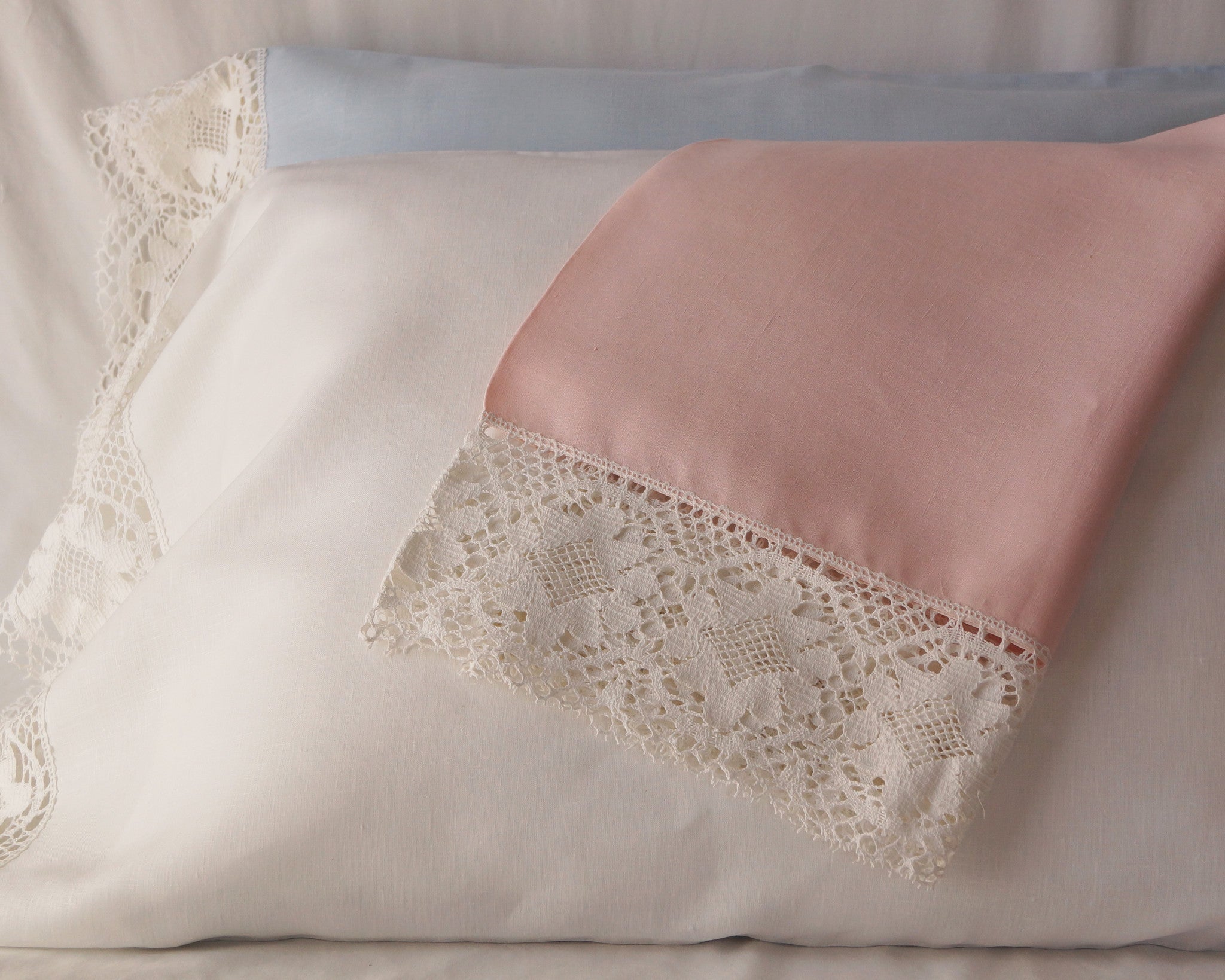 Linen pillow case with 4" cluny lace edge. In white, pink or blue, with white lace.