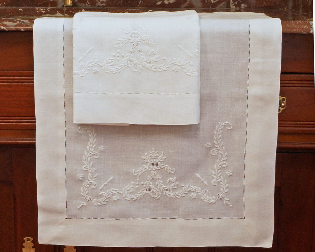 linen guest towel. Hand embroidered
in white work type embroidery