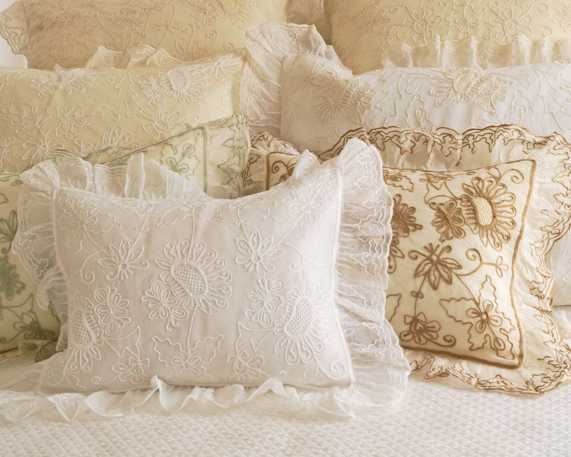 Organdy pillow shams with ruffled flange and embroidered with sunflower like motif . Boudoir, standard and euro sizes.