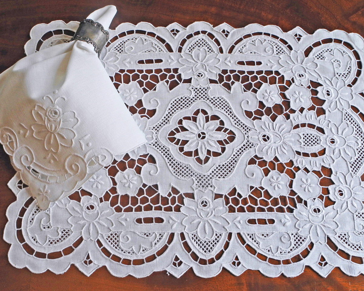 Placemat and napkin set, hand embellished with elaborate cut work and drawn work embroidery.