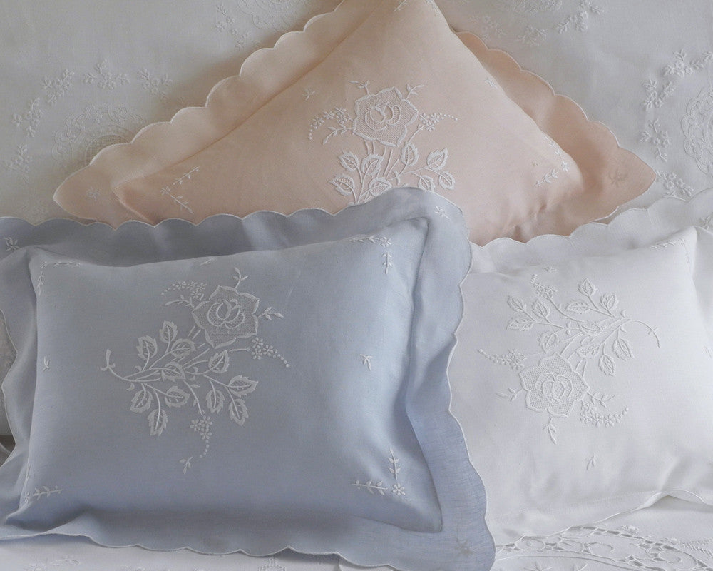 Boudoir pillow sham with delicate floral embroidery on front. White, pink and blue.