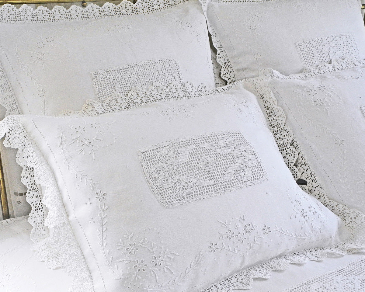 Pillow shams in standard and euro sizes. Embroidered by hand on fine quality of linen. Finished with hand crochet flange and crochet inset.