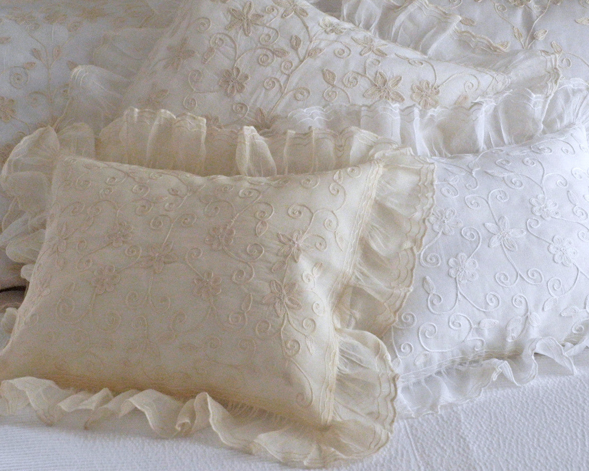 Boudoir pillow sham with ruffle, embroidered with star like pattern.