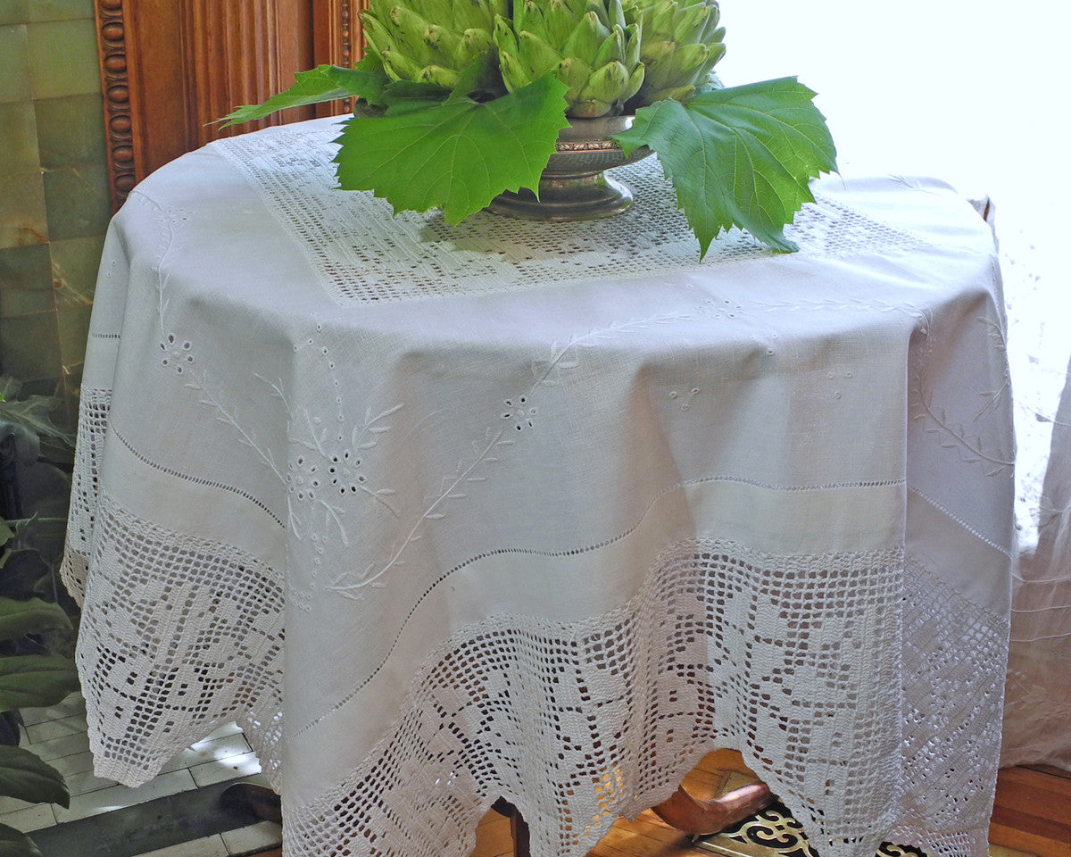 52" square linen tablecloth embroidered in French Country style with 6" crochet border and center crochet inset.