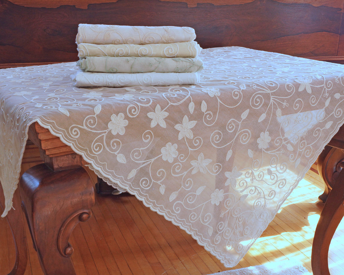 42" square embroidered cotton organdy tablecloth. Embellished with star like pattern. 