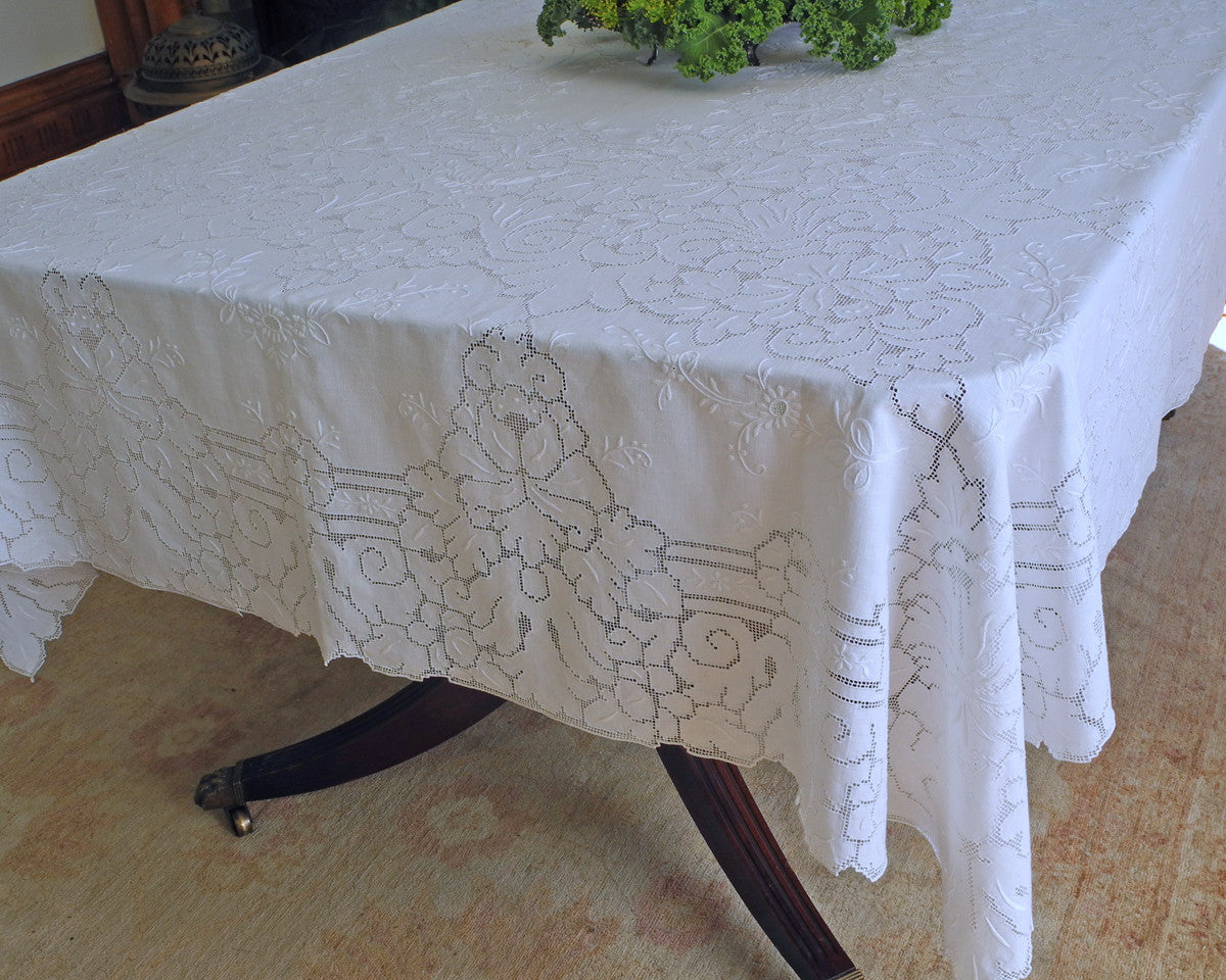 Pure linen dining tablecloth embellished with beautiful quality of drawn work style embroidery. 