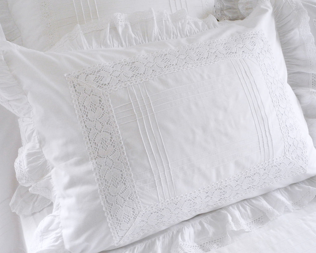 Standard pillow sham in white cotton decorated in vintage style with tucks lace insets and ruffle. ONLY EMBROIDERY